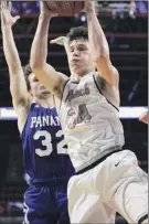  ?? Erin Reid Coker / Special to Times Union ?? OESJ’S Tyler Leon pulls down a rebound Saturday against Panama. His only 3-pointer of the season and a foul shot forced overtime.