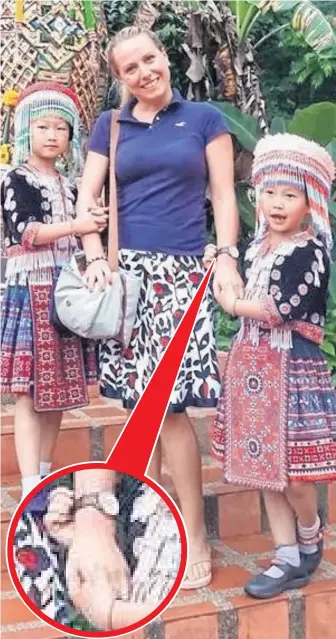  ?? Pictures: MEDARD BOSS/REDDIT ?? On closer inspection, circled, one of the girls in the photograph is stealing the watch