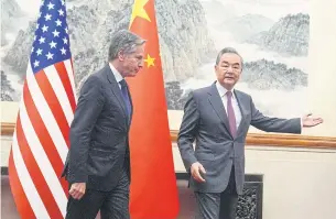  ?? AFP ?? US Secretary of State Antony Blinken follows China’s Foreign Minister Wang Yi during a meeting at the Diaoyutai State Guesthouse in Beijing yesterday.