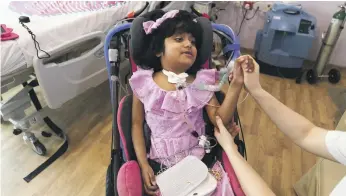  ?? Reem Mohammed / The National ?? Meznah Basaloum, 7, is paraplegic. Her rehabilita­tion and education at Amana Heathcare means a return to a mainstream school is imminent