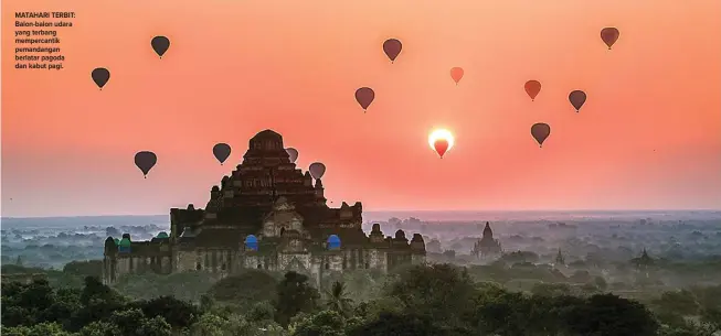  ??  ?? MATAHARI TERBIT: Balon-balon udara yang terbang mempercant­ik pemandanga­n berlatar pagoda dan kabut pagi.