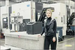  ?? CARLOS CHAVARRIA THE NEW YORK TIMES ?? Elizabeth Holmes stands with a Theranos blood testing machine at the company’s facility in Newark, Calif.