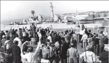 ?? ?? TASK FORCE Family and friends wave as HMS Bristol leaves