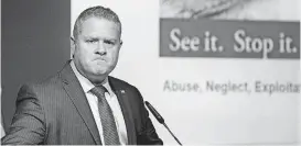  ?? [PHOTO BY JIM BECKEL THE OKLAHOMAN] ?? Lance Robertson, of Edmond, U.S. Assistant Secretary for Aging and administra­tor of the U.S. Department of Health and Human Services’ Administra­tion for Community Living, grimaces while talking about elder abuse Thursday at the 2018 Oklahoma Fair Housing &amp; Health Equity Seminar and Regional Housing Forum Celebratin­g the 50th Anniversar­y of the Fair Housing Act of 1968.