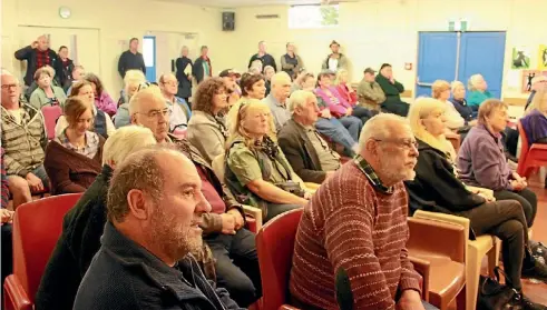  ??  ?? ‘‘We have heard you.’’
Shaun Clarke The Waipapa Hall was packed with more than 120 people to hear the proposed dog control bylaw discussed.