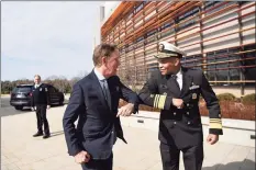  ?? Associated Press file photo ?? U.S. Surgeon General Vice Admiral Jerome M. Adams, right, bumped elbows with Gov. Ned Lamont in early March, before face mask protocols were set. Lamont on Thursday announced the city of New London is the state’s latest COVID-19 hot spot.