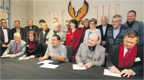  ??  ?? Signing a new constituti­on for the South Vancouver Island Regional Economic Developmen­t Associatio­n are, from left, Allan Cahoon of Royal Roads University, Lisa Marie A’Hara of Coast Capital, Songhees Chief Ron Sam, View Royal Mayor David Screech, and...