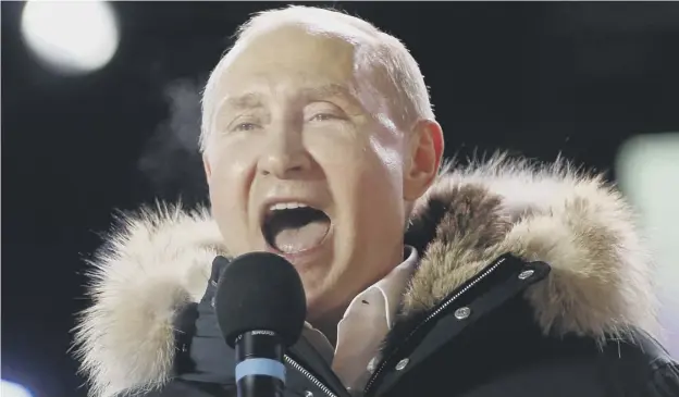  ??  ?? 0 Roaring to go: Vladimir Putin addresses a rally after his sweeping victory in the Russian presidenti­al elections
PICTURE: ALEXANDER ZEMLIANICH­ENKO/AP