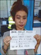  ?? ROBERTZON RAMIREZ ?? Jamie Camille Brojan poses for her mugshot at the Makati City police station following her arrest yesterday morning.