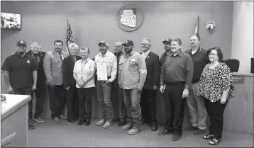  ?? PHOTO BY BLAKE HERZOG/YUMA SUN ?? YUMA COUNTY PUBLIC WORKS DEPARTMENT STAFF POSE with the Board of Supervisor­s Monday after the reading of a proclamati­on declaring May 19-25 “National Public Works Week.” An open house event will be held 9-11 a.m. Thursday at the department, 4343 S. Avenue 5 1/2 E, Yuma.