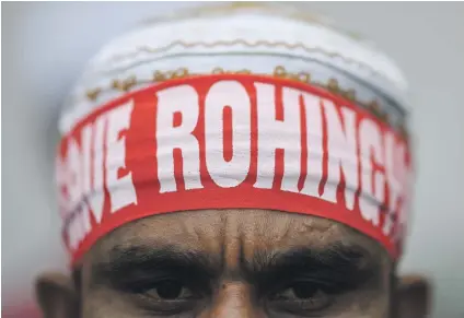  ?? Picture: AFP ?? STATEMENT. A Rohingya refugee living in Malaysia wears a headband reading ‘Save Rohingya’ during a protest against the treatment of Rohingya Muslims in Myanmar, in Kuala Lumpur yesterday.