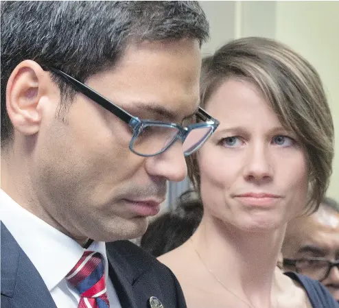  ?? RYAN REMIORZ / THE CANADIAN PRESS ?? MNA Gerry Sklavounos, booted out of the Liberal caucus for alleged sexual impropriet­ies, speaks to media alongside wife Janneke Thursday in Montreal. Sklavounos says he will return to the legislatur­e next week.