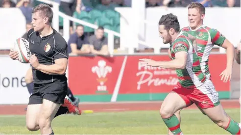  ??  ?? ● RGC centre Tom Hughes scored a cracking try at Carmarthen Quins. Hughes is pictured in recent action against Llandovery. Pic: STEVE LEWIS