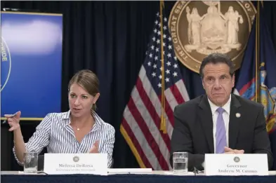  ?? MARY ALTAFFER — THE ASSOCIATED PRESS FILE ?? On Sept. 14, 2018, Secretary to the Governor Melissa DeRosa, is joined by New York Gov. Andrew Cuomo as she speaks to reporters during a news conference, in New York. De Rosa, Cuomo’s top aide, told top Democrats frustrated with the administra­tion’s long-delayed release of data about nursing home deaths that the administra­tion “froze” over worries about what informatio­n was “going to be used against us,” according to a Democratic lawmaker who attended the Wednesday, Feb. 10, 2021, meeting and a partial transcript provided by the governor’s office.