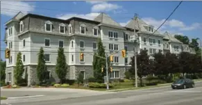  ?? DAVID BEBEE, RECORD STAFF ?? Bryan Hunking of Elmira built Emmanuel Village with funds from his fraud victims, many of them elderly. The court recently approved the sale of the main four-storey building to Revera Inc.