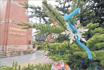  ?? TINA COMEAU PHOTO ?? Ornaments made by children adorn the Christmas tree outside the Yarmouth town hall. There is a sadness in the community since last weekend’s tragedy that impacted and changed many lives.