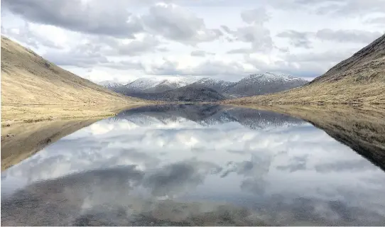  ?? P H O T O S : D AV I D B R O WN/ T H E WA S H I NG T O N P O S T ?? Loch Calavie, a small lake near Scotland’s west coast where David Brown camped alone on his first day of a 14- day trek across Scotland.