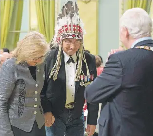  ?? CP PHOTO ?? Governor General David Johnston acknowledg­es Wilton Littlechil­d and Marie Wilson before presenting them with the Meritoriou­s Service Cross during a ceremony at Rideau Hall, Monday. Johnston has issued an apology for referring to Canada’s indigenous...