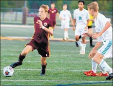  ?? SUZANNE TENNANT/POST-TRIBUNE ?? Bowser, left, heads toward Valparaiso’s goal during a 2018 game.