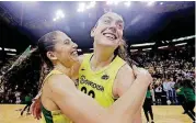  ?? [AP PHOTO] ?? Seattle’s Sue Bird, left, hugs Breanna Stewart after the Storm defeated Phoenix in a decisive Game 5 of the WNBA semifinals Tuesday.
