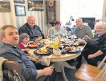  ??  ?? Glenn Ringer, front, sits at the head of the table during a Christmas dinner with his family in Consett County, Durham in 2017. With him are, clockwise from Glenn, his daughter Eva, John Dunn, Jean Ringer, Keith Ringer and Marjorie Dunn.