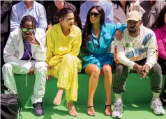  ??  ?? Top: Scott and his dad, a drummer. Above: Scott, Kylie Jenner, Kim Kardashian and Kanye West in Paris in June. “Everybody go through shit,” Scott says of West. “He still a dope musician.”FAMILY MAN