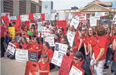  ?? PHOTOS BY TOM TINGLE/THE REPUBLIC ?? Hundreds of teachers called in sick Wednesday and protested at the Capitol over low pay.