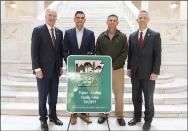  ?? Photo courtesy of Arkansas Governor’s Office. ?? The Fisher-shaffer Family Farm was inducted into the Arkansas Century Farm Program on Nov. 5. Members of the family were congratula­ted by Gov. Asa Hutchinson.