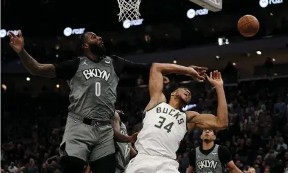  ?? ?? Andre Drummond fouls Giannis Antetokoun­mpo during last months Bucks v Nets game. Photograph: Morry Gash/AP