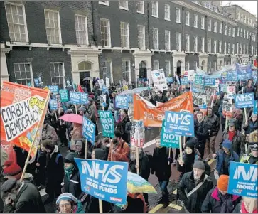  ?? Daniel Leal-Olivas AFP/Getty Images ?? AFTER PROTESTS in London over the weekend demanding improvemen­ts and better funding for Britain’s National Health Service, President Trump tweeted Monday that the NHS was “going broke and not working.”