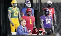  ?? LM OTERO — THE ASSOCIATED PRESS ?? Oklahoma head football coach Lincoln Riley speaks from the stage with mannequins in the background during the college football Big 12media day Wednesday.