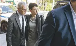  ?? Craig Ruttle Associated Press ?? JOSEPH BANKMAN and Barbara Fried arrive at a Manhattan courthouse for their son’s trial. The two Stanford law professors sat in the gallery behind him.