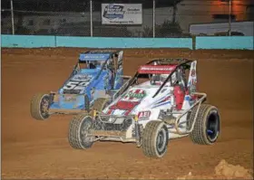  ?? CARL HESS - FOR DIGITAL FIRST MEDIA ?? In the battle of the Buckwalter­s, Steve Buckwalter (#56) is seen leading with cousin Tim (#52) challengin­g on the outside. At the end of the 75 lap “Dick Tobias Memorial” it was Tim Buckwalter taking the win with Steve finishing runner-up.