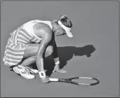  ?? AP/ANDRES KUDACKI ?? Lesia Tsurenko, of Ukraine, kneels on the court Monday during her match against Marketa Vondrousov­a, of the Czech Republic, in the fourth round of the U.S. Open tennis tournament in New York.