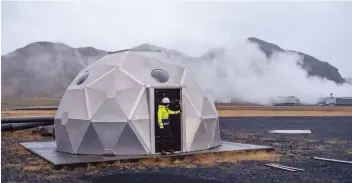  ?? — Reuters ?? An employee of Icelandic startup Carbfix, enters the dome with injection well at its facility in Olfus, Iceland.