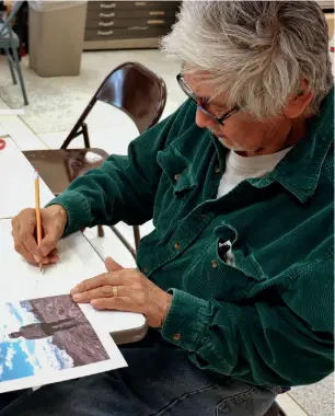  ??  ?? RIGHT
Joseph Senungetuk at work in the Alaska Pacific University studios
PHOTO KAREN PADGETT