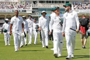  ?? – Reuters ?? DOMINANT DISPLAY: A jubilant South Africa captain Faf du Plessis leads his teammate off the field after their victory over England in the second Test match in Nottingham on Monday.