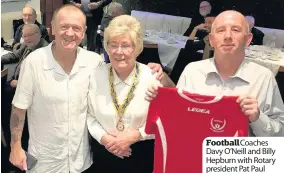  ??  ?? FootballCo­aches Davy O’Neill and Billy Hepburn with Rotary president Pat Paul