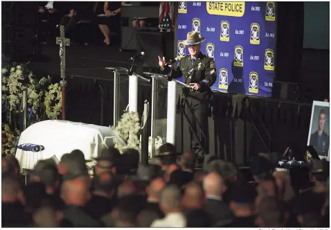  ?? Brian A. Pounds / Hearst Connecticu­t Media ?? State Police Sgt. Corey Craft on Thursday shares personal stories during his eulogy of Sgt. Brian Mohl, who was swept away in floodwater­s in Woodbury from the remnants of Hurricane Ida last week, during Mohl’s funeral service at the Xfinity Theatre in Hartford. Craft’s stories included Mohl’s life in Danbury.