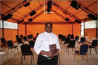  ?? (AP/Brian Inganga) ?? Associate Pastor Caroline Omolo stands for a portrait Oct. 11 at the Cosmopolit­an Affirming Community church. “They have always organized a group to maybe silence us or make the church disappear,” Omolo says. “They don’t want it to appear anywhere.”