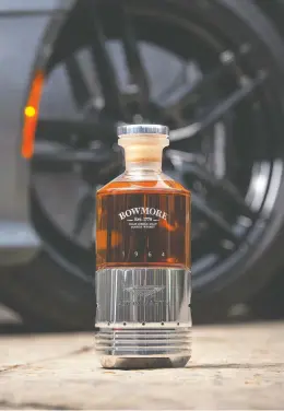  ?? BEAM SUNTORY ?? A highly coveted bottle of the rare Black Bowmore 1964 DB5 31-year old scotch whisky
will be going up for sale at Ontario's LCBO for $85,000 — plus a 20-cent deposit.