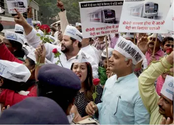  ?? — PTI ?? AAP MLA Somnath Bharti with party workers during a protest against Metro fare hike near the residence of BJP MP Meenakshi Lekhi in New Delhi on Friday.