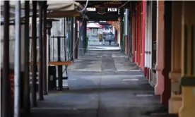  ?? Photograph: James Ross/EPA ?? Melbourne’s normally bustling Lygon Street was empty in early June during the city’s fourth lockdown. Australian spending for the month was down as the pandemic took its toll.