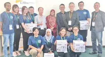  ??  ?? Standing, from third right: Cheng and Coswald with team members who won the Best Project Award with their ‘Sustainabi­lity Designatio­n and Implementa­tion of the Idea of Biosand Filter at Kampung Singgaron, Ranau’.