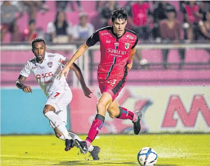  ??  ?? Chainat’s Marco Ballini, right, during a recent Thai League 1 match against Muang Thong United.