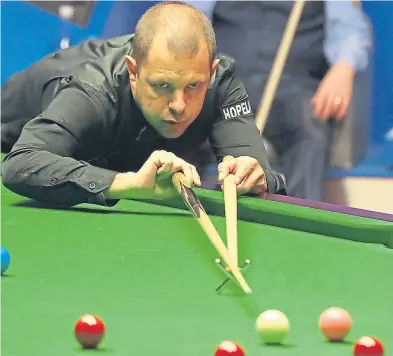  ??  ?? Barry Hawkins at the table as he begins to wrestle back control against Mark Williams.