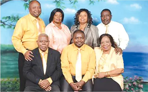  ?? ?? Elder Raphael Kubaga (front, left) with his family in this file photo. – Photo: issamichuz­i-blogspot-com