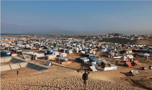  ?? AFP ?? A camp for displaced people in Gaza. Qatar has told the World Economic Forum a two-state solution to the Palestinia­n-Israeli conflict is key to regional peace