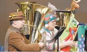  ?? STEVE RUARK/FOR BALTIMORE SUN MEDIA GROUP ?? Stephen Franzoni, left, of Joppatowne and John Gillette of Aberdeen perform in the 11th annual Merry Tuba Christmas Bel Air concert at Bel Air High School.