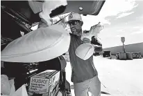  ?? Tribune News Service ?? n Charlie Garcia puts sandbags in his truck. He evacuated from the Florida Keys. He says he is going to stay in Miami because there is nowhere else to go. Preparatio­ns are under way for Hurricane Irma, as it makes its way towards Florida.